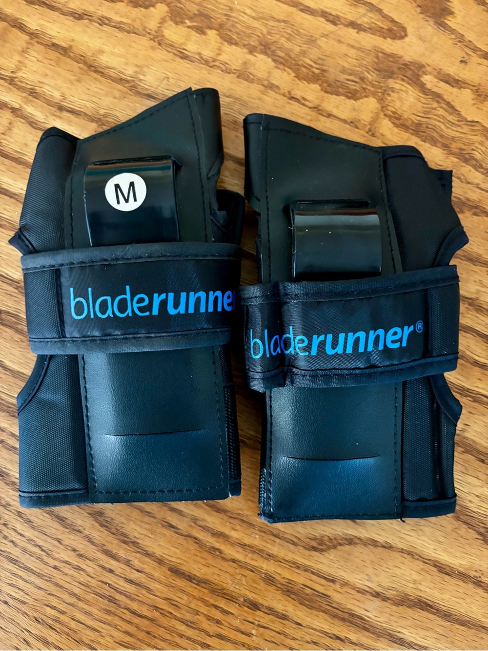 BladeRunner Women’s Black Wrist Guards with Blue Logo - Medium